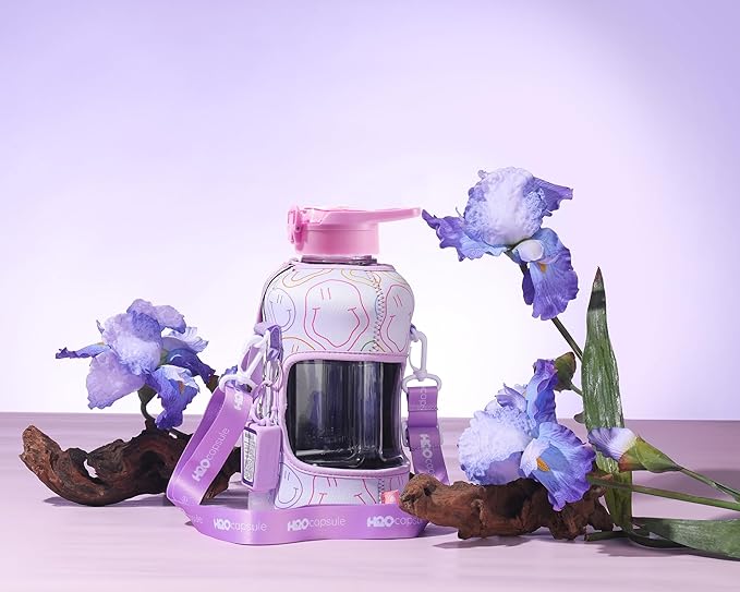 H2O Capsule 2.2L Half Gallon Water Bottle with Storage Sleeve and Removable Straw – BPA Free Large Reusable Drink Container with Handle - Big Sports Jug, 2.2 Liter (74 Ounce), Purple Smiley